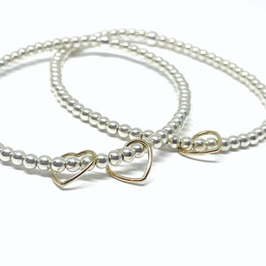 The “Golden Hearts" Sterling Silver Bracelet